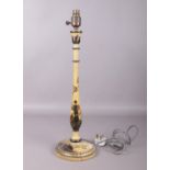 A Turned Chinoiserie table lamp. Comprising of an off white ground with figure of a woman and