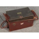 A metal security box by Security Products Manufacturing Co. With leather mounted carry case.