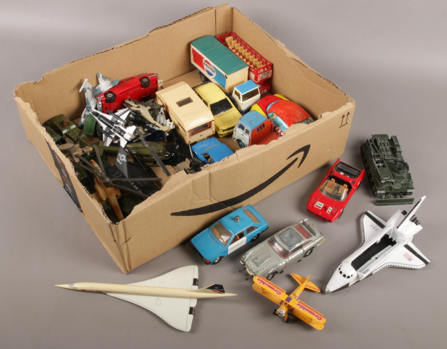A box of mainly diecast vehicles. Includes Corgi 007 Aston Martin DB5, Matchbox, ERTL etc.