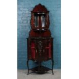 A decorative glazed Mahogany corner unit. Comprising of a mirrored back and two door cupboard to the