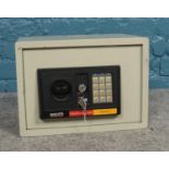 A Blackspur ES100 electronic safe with instruction manual and override key. (35cm x 25cm x 25cm)