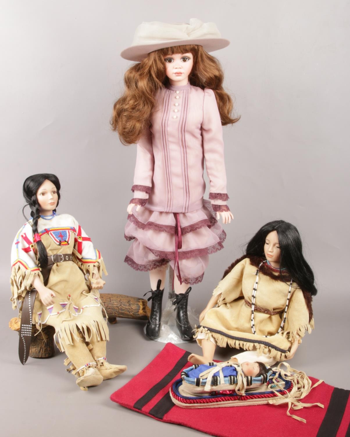 A quantity of porcelain dolls. ' Sacajawea' & ' Minihaha' boxed dolls the hamilton collection by