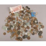 A quantity of coins. Including silver, foreign, crowns, tokens, banknote, etc.