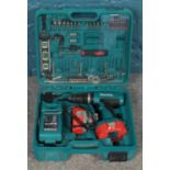 A Makita 8390D cordless drill, with spare battery, charger and a large quantity of drill bits, and