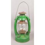 A green painted paraffin lamp. Stamped K2 88 on the base.