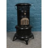 A vintage Valor Parafin heater. H: 61cm, W:29cm.