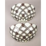 A pair of Tiffany style leaded glass uplighter wall shades. H:18cm, W:30cm.