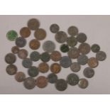 A collection of antique copper pennies and half pennies, mainly Georgian examples.