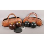 Two pairs of crown green bowls, in travel bags. Also includes a set of measures and foot mat.