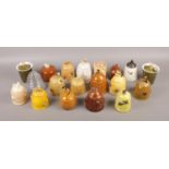 A collection of twenty assorted honey pots.