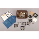 A box of pre decimal coins. Including two maundy money coins, silver three pennies, foreign,