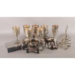 A collection of assorted metalwares. To include six EPNS goblets, a silver plated Viners candle