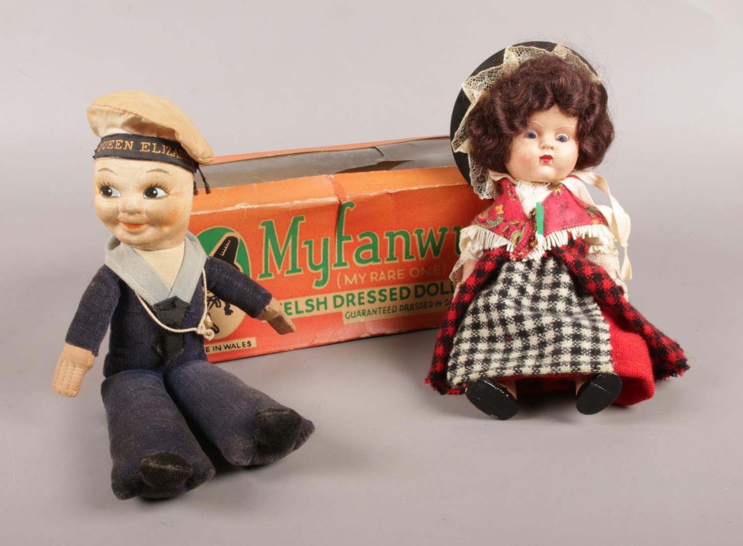 Two vintage dolls: a boxed Myfanwy welsh dressed doll, together with a Queen Elizabeth sailor