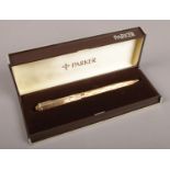 A boxed gold plated Parker pen.