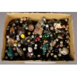 A box of alcohol miniatures. Including brandy, whiskey, novelty bottle examples, etc.