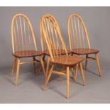 Four Ercol golden dawn beech/elm dining chairs.