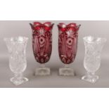 A pair of cut glass ruby flash vases along with a pair of clear cut glass vases. Ruby examples 34cm.