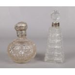 Two glass and silver perfume bottles. To include a silver collared bottle, assayed in London 1905,