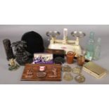 A quantity of collectables. Including scales, horse riding helmet, medal, scent bottles, figural