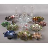 A box of glassware. Including carnival glass, decanters, cut glass bowl, etc.