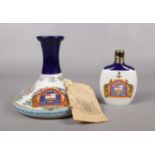 Two sealed commemorative issue bottles of Pusser's Rum. To include a The Nelson Ship`s decanter