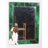 A rectangular bevel edge mirror, framed by green stained glass panels and Spaniel to the corner.