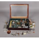 A wooden and glazed bijouterie cabinet with an assortment of collectables. To include a Stratton