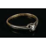 An 18ct gold diamond solitaire ring. Size K½. Diamond 1/16 ct. Total weight: 1.74g.