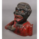 A novelty cast iron money box.