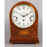 A mahogany cased Comitti of London mantel clock. Decorated with shell patera. With Franz Hermle