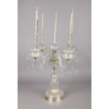 A 20th century cut glass four branch candelabra. Each arm hung with faceted droplets and wax