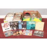 Two boxes of 45 rpm vinyl records. Elton John, Right Said Fred, Yazoo, Sinatra, Kylie, New Kids on
