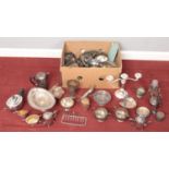 A box of silver plated metalwares. Including Recent plate three piece teaset, vases, jugs,