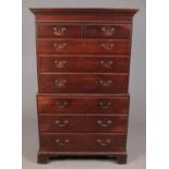 A Georgian oak chest on chest. With dentil moulding and ogee bracket supports.