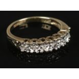 A 9ct gold and seven stone diamond ring. Size L. Total weight: 2.08g