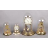 Four brass torsion clocks, for restoration. Includes one Schatz example.