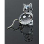 A boxed silver crystal Swarovski cat. H: 3cm. Comes with certificate and original box.
