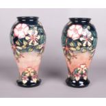 A pair of large Moorcroft pottery baluster shaped vases decorated in the Oberon pattern, designed by