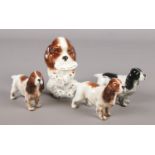 Four Beswick porcelain figures of dogs. Includes My Plate example.