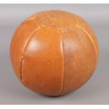 An early Twentieth Century 2½kg leather medicine ball, purportedly from Barnsley Comprehensive
