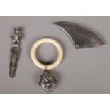 Three items of silver to include paperclip book mark with bear finial, Baby's teething ring &