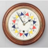 An oak cased wall clock bearing RAF insignia.