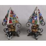 A pair of Peter Marsh style coloured glass and wrought iron table lamps.