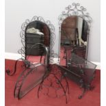 A metal framed pier mirror along with a metal wine rack and magazine rack.