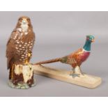Two Beswick bird figures; Model 1774 of a Pheasant and a Beneagles Buzzard, modelled by JJ Tongue,
