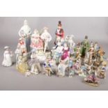 A box of ceramic figures. Including Lladro style, Leonardo Collection, etc.
