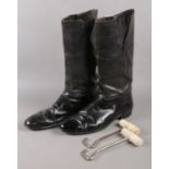 A pair of vintage leather riding boots, with bone boot pulls.