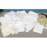 A box of assorted vintage linens. Tablecloths, napkins, dollies.