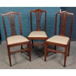 A set of six oak dining chairs, including two carvers.