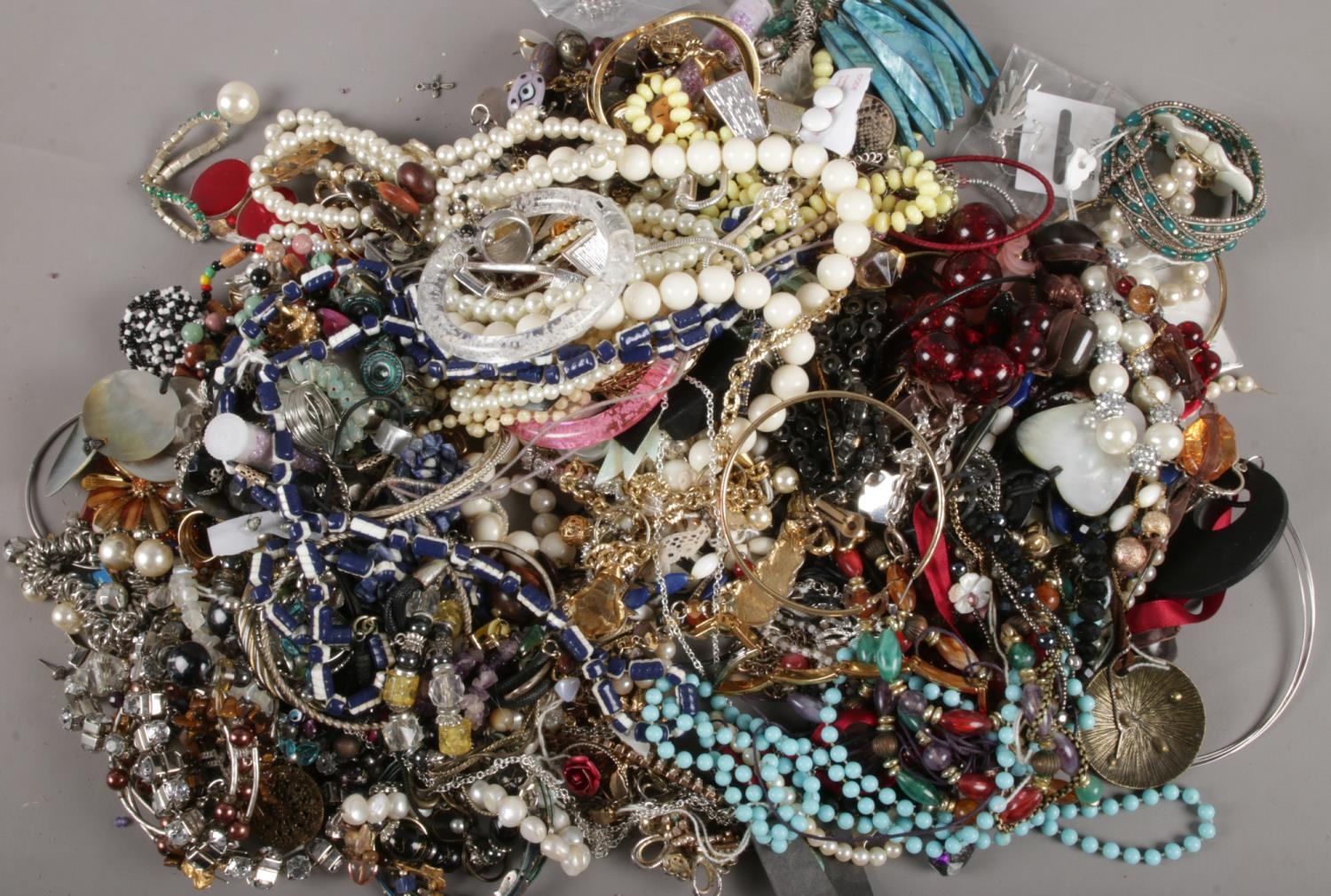 A box of assorted costume jewellery. To include brooches, necklaces, earrings and bracelets etc. - Image 2 of 2